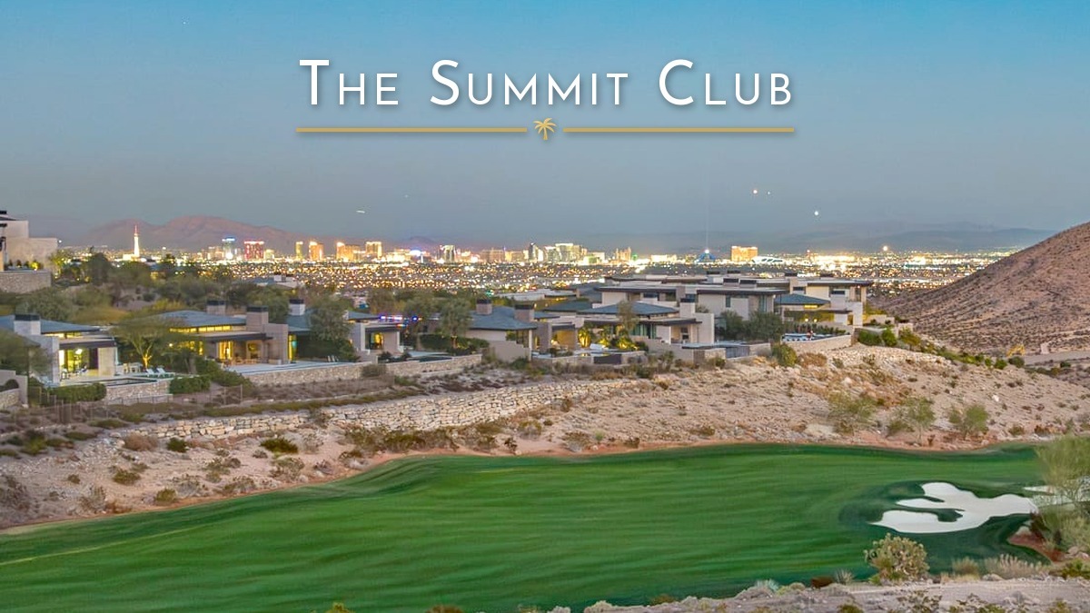 The Summit Club in Summerlin at early evening, with homes above a golf fairway and the Las Vegas Strip lit up in the distance.