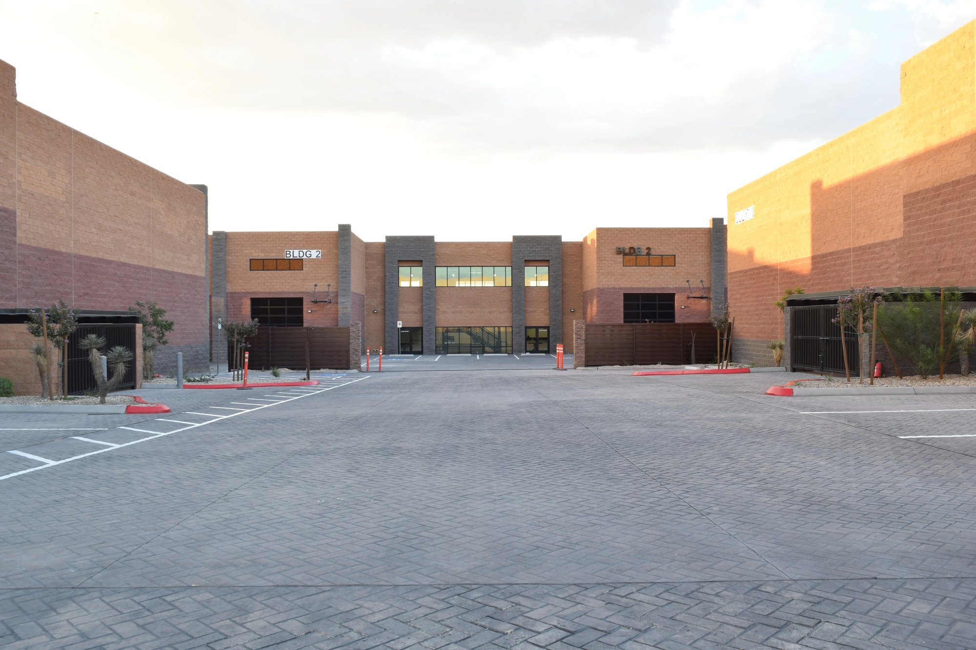 Gated courtyard at The Stack Auto Lofts with parking in front of the units